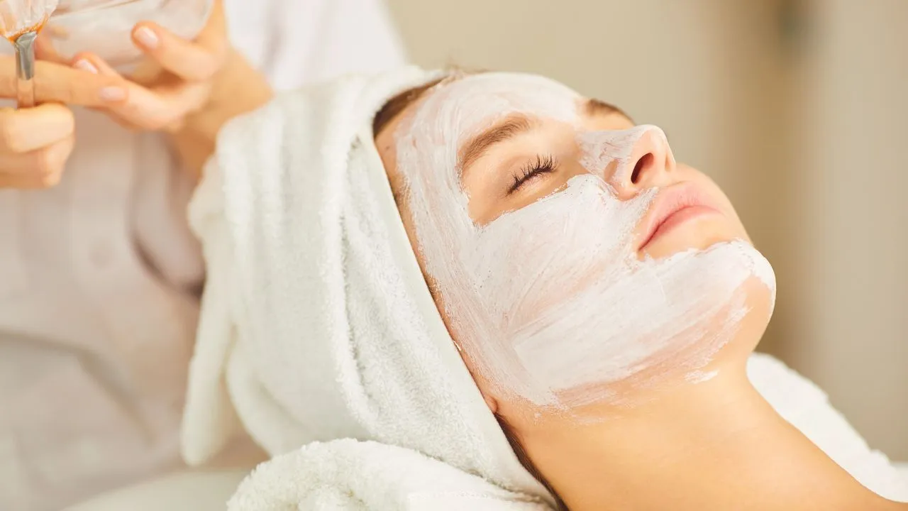 women Lie on chair with Facemask for glowing face